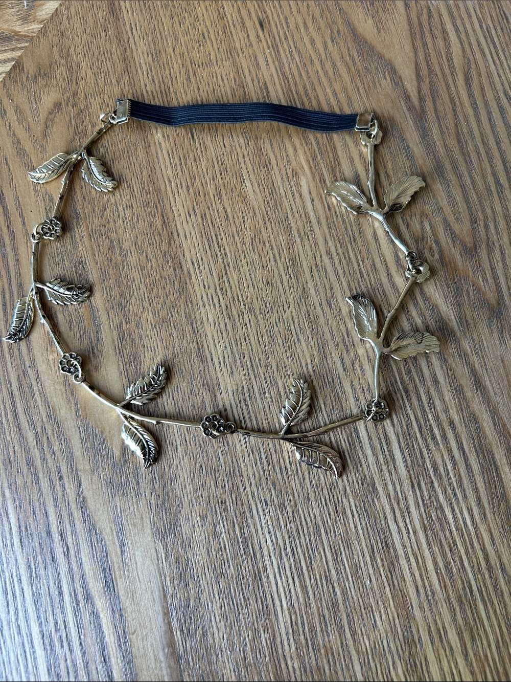 Gold-colored hair accessories with a leaf design.